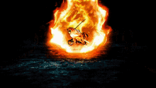 a large fire is coming out of a hole in the ground