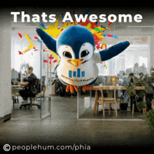 an advertisement for peoplehum.com/phia shows a stuffed penguin in an office