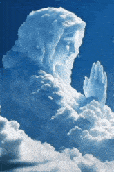 a statue of a woman in the clouds with her hands folded in prayer