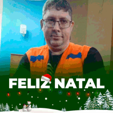 a man wearing glasses and an orange vest with the words feliz natal on the bottom