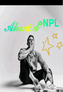 a black and white photo of a man sitting on the floor with the name ahmed npl