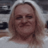 a close up of a woman 's face with blonde hair