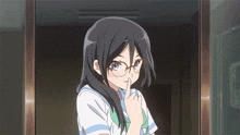 a girl with glasses is holding her finger to her lips