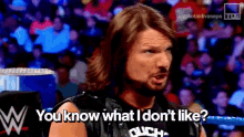 a man in a wrestling ring says you know what i don 't like .