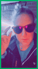 a person wearing sunglasses and a jacket that says genware on the side