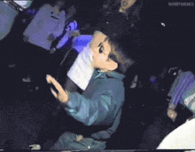 a pixelated image of a boy dancing in a club