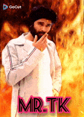 a man with a beard is on a poster that says mr.tk on it