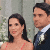 a man and a woman standing next to each other