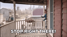 a woman standing on a porch with the words stop right there