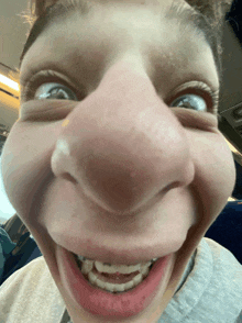 a close up of a person making a funny face with their mouth open