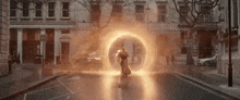 doctor strange is standing in the middle of a street with a portal coming out of him .