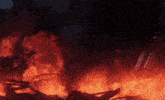 a building is on fire with the letters eee visible in the background