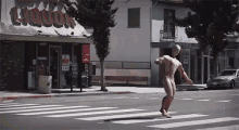 mannequin crossing the street
