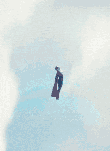 a person flying through the clouds with a briefcase