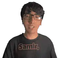 a man wearing glasses and a black shirt that says samir