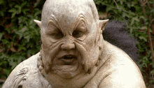 a close up of a statue of a man with a beard