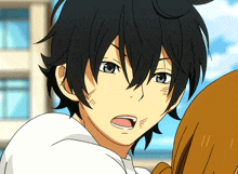 a close up of a person 's face with black hair