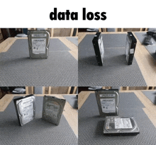 four hard drives are sitting on a table with the words data loss written above them
