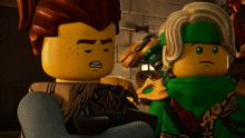 two lego ninjago characters are standing next to each other with one wearing a green scarf around his neck