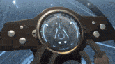 a close up of a steering wheel with a circular display that says ' a / a ' on it
