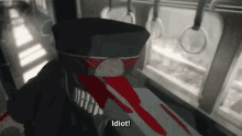a cartoon of a man with blood on his face and the words idiot below him