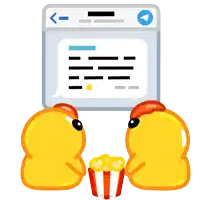 two yellow rubber ducks are eating popcorn in front of a computer screen
