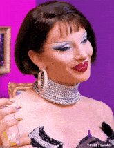 a close up of a woman wearing a choker necklace