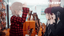 a girl in a plaid shirt is taking a picture of two other girls in a store