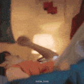 a blurry picture of a person laying on a bed with the name meow_keen on the bottom