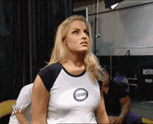 a woman wearing a shirt that says 100 % on it