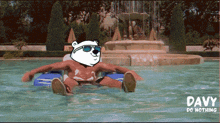 a polar bear wearing sunglasses is floating on a raft in a swimming pool
