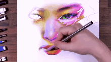 a person drawing a woman 's face with a pencil