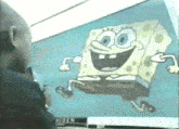 a man is looking at a picture of spongebob squarepants