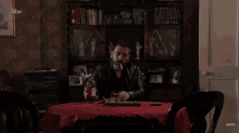 Peter Sits Alone At A Table And Pours A Whiskey Coronation Street GIF - Peter Sits Alone At A Table And Pours A Whiskey Coronation Street Peter Barlow GIFs