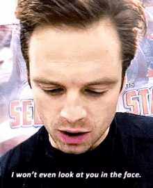 a close up of a man 's face with the words " i won 't even look at you in the face "