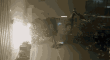 a person is standing in a dark room with a large object in the background that has the number 10 on it