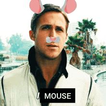 a man with bunny ears and a sign that says i mouse