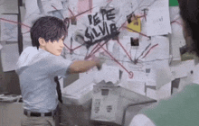 a man standing in front of a wall that says pepe silvie