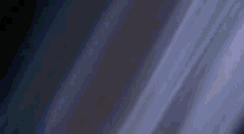 a person 's hand is reaching out towards a green lightning circle