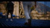 a blurry picture of a person walking on a bridge .