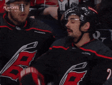 a hockey player wearing a jersey with the number 4 on it