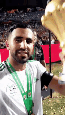 a man with a medal around his neck that says world cup 2010
