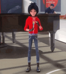 a boy in a red hoodie is standing in front of a piano with a man in a blue shirt behind him