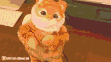 a stuffed cat is standing on its hind legs with a lolshanedawson watermark