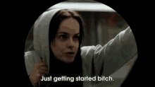 a woman in a hoodie is saying " just getting started bitch "