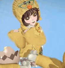 a girl wearing a yellow sweater and a yellow hat with a duck on it .