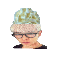 a person wearing glasses and a hat with whipped cream on it