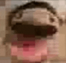 a close up of a person 's face with a blurry background