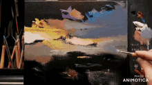 a painting is being painted on a canvas with the words made in animotica on the bottom right