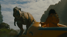 a t-rex is standing next to a person in a raft